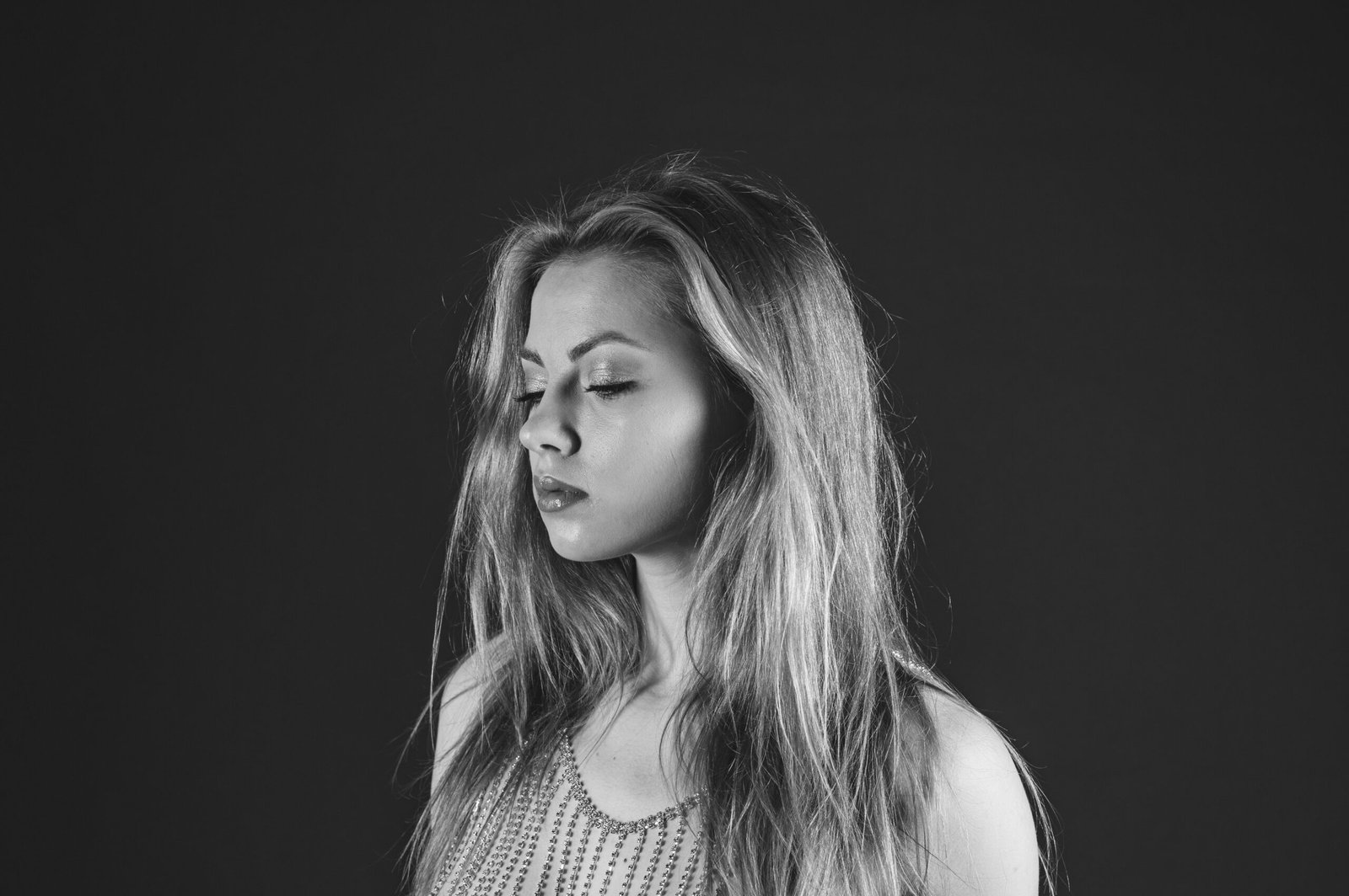 a black and white photo of a woman with long hair